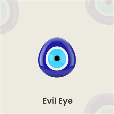 Blue evil eye amulet on light background with circular patterns, symbolizing protection