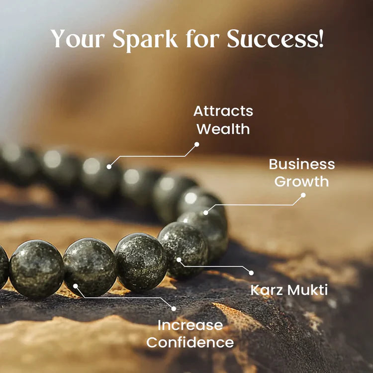 Dark green stone bead bracelet on wooden surface with text highlighting wealth, business growth, confidence