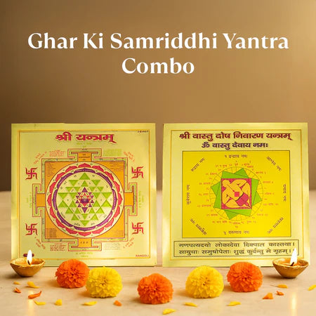 Ghar Ki Samriddhi Yantra Combo with decorative marigold flowers and oil lamps on brass plate