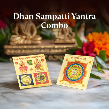 Dhan Sampatti Yantra Combo with two sacred geometric yantra cards on marble surface, decorative statue and flowers blurred in background
